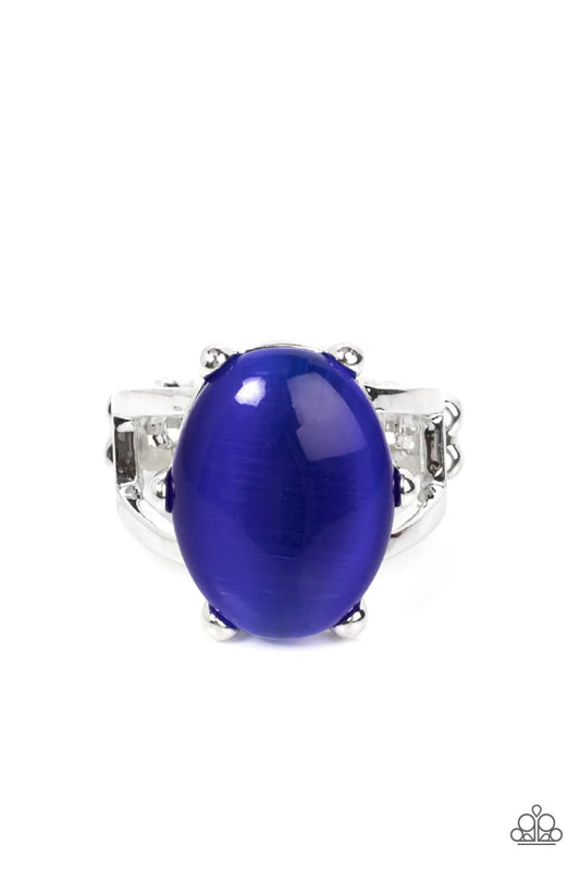 Paparazzi Accessories Enchantingly Everglades - Blue An oval blue cat's eye gemstone sits atop a pronged silver frame along two layered silver bands, resulting in an enchanting centerpiece atop the finger. Features a stretchy band for a flexible fit. Sold