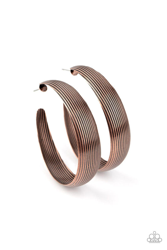 Paparazzi Accessories Desert Wandering - Copper Lined in antiqued ridges, a thick copper hoop curls around the ear for an authentically rustic look. Earring attaches to a standard post fitting. Hoop measures approximately 2 ¼” in diameter. Sold as one pai