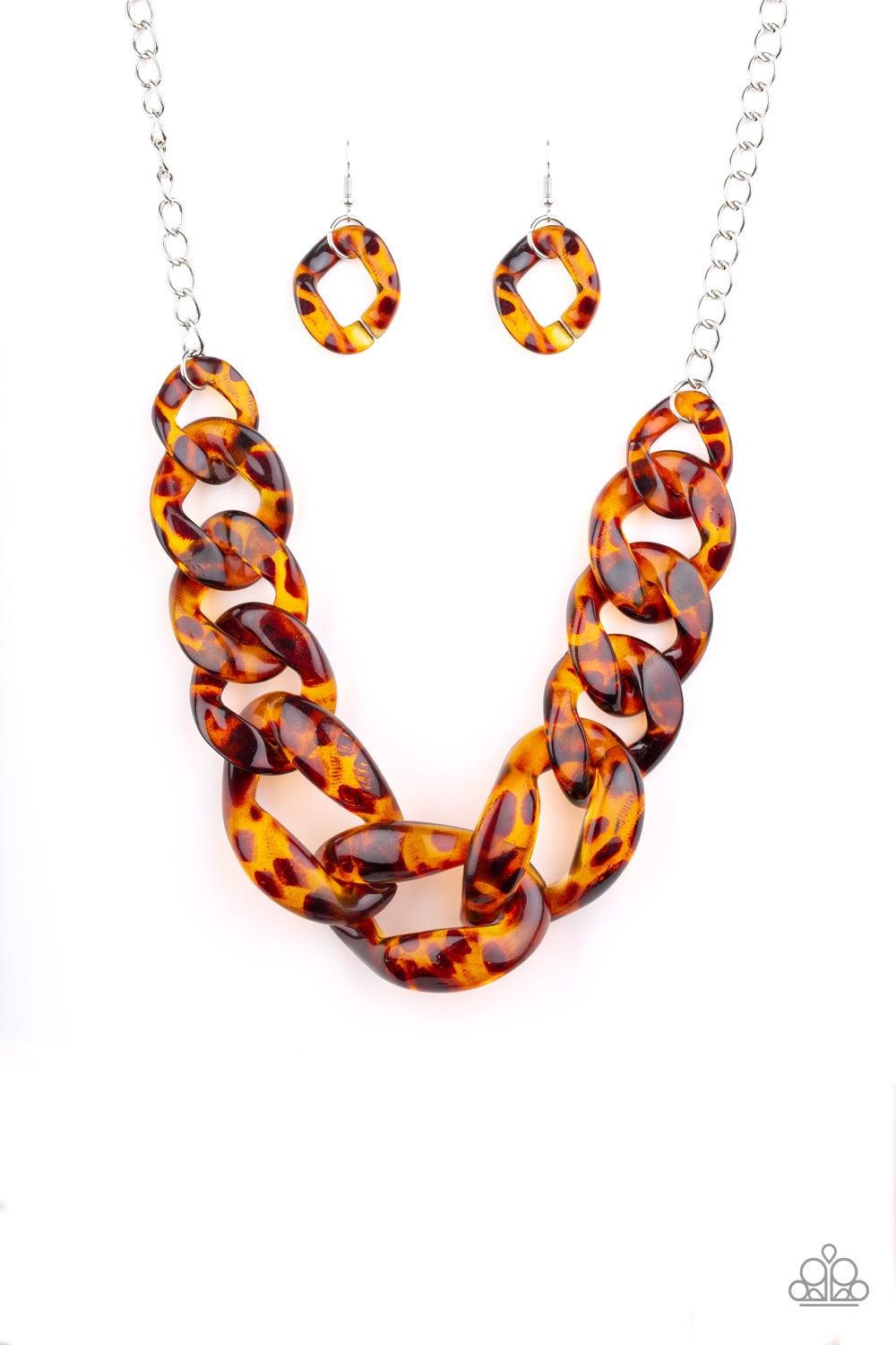 Paparazzi Accessories Red-HAUTE Mama - Brown Featuring a tortoise shell finish, brown acrylic links gradually increase in size as they link below the collar in a statement-making fashion. Features an adjustable clasp closure. Jewelry