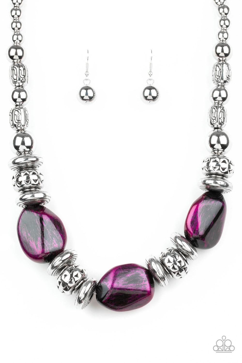 Paparazzi Accessories Colorfully Confident - Purple A collection of classic silver beads, ornate silver accents, and metallic purple faux rock beads are threaded along an invisible wire below the collar for a statement-making finish. Features an adjustabl