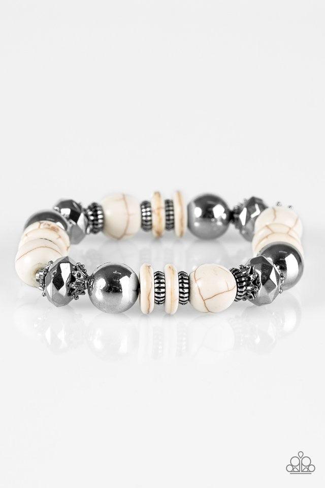 Paparazzi Accessories Mesa Maverick - White Refreshing white stone beads are threaded along a stretchy elastic band. Featuring smooth and faceted surfaces, shiny silver accents are sprinkled between the earthy stones, adding a shimmery finish to the seaso