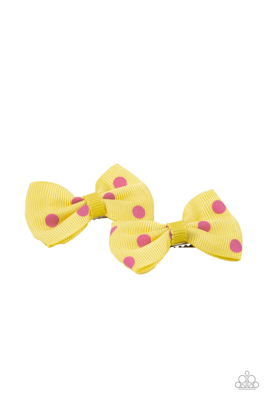 Paparazzi Accessories Polka Dot Drama - Yellow Featuring flirty pink polka dots, a dainty pair of yellow ribbon bows pull back the hair for a playful fashion. Features standard hair clips on the back. Sold as one pair of hair clips. Hair Pins