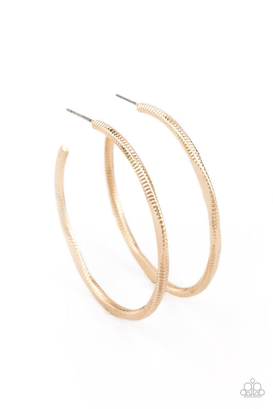 Paparazzi Accessories Spitfire - Gold Featuring flattened sections, a textured gold hoop boldly curls around the ear for an edgy flair. Earring attaches to a standard post fitting. Hoop measures approximately 1 3/4" in diameter. Sold as one pair of hoop e