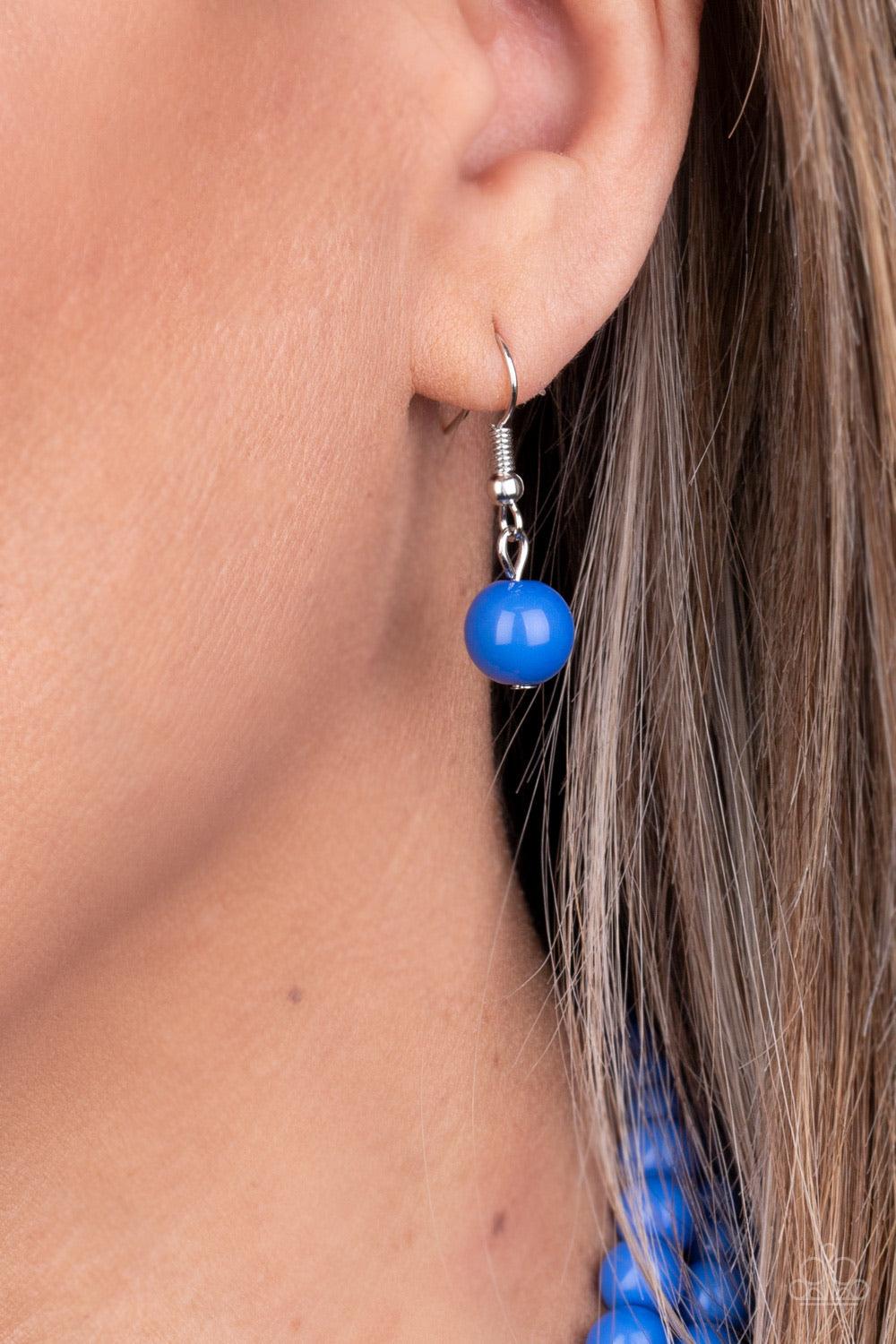 Paparazzi Accessories Beach Bauble - Blue Held together by dainty silver fittings, strands of beads fade from blue to orange to navy blue along invisible wires below the collar for a statement-making finish. Features an adjustable clasp closure. Sold as o