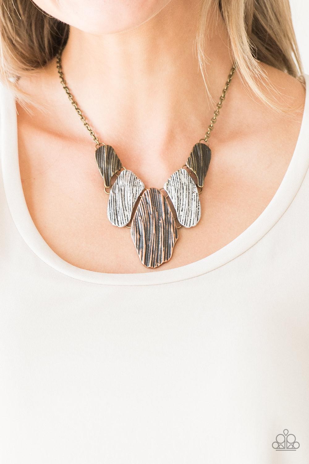 Paparazzi Accessories A New DISCovery - Multi Engraved in antiqued textures, asymmetrical brass, copper, and silver plates link below the collar for an edgy look. Features an adjustable clasp closure. Sold as one individual necklace. Includes one pair of