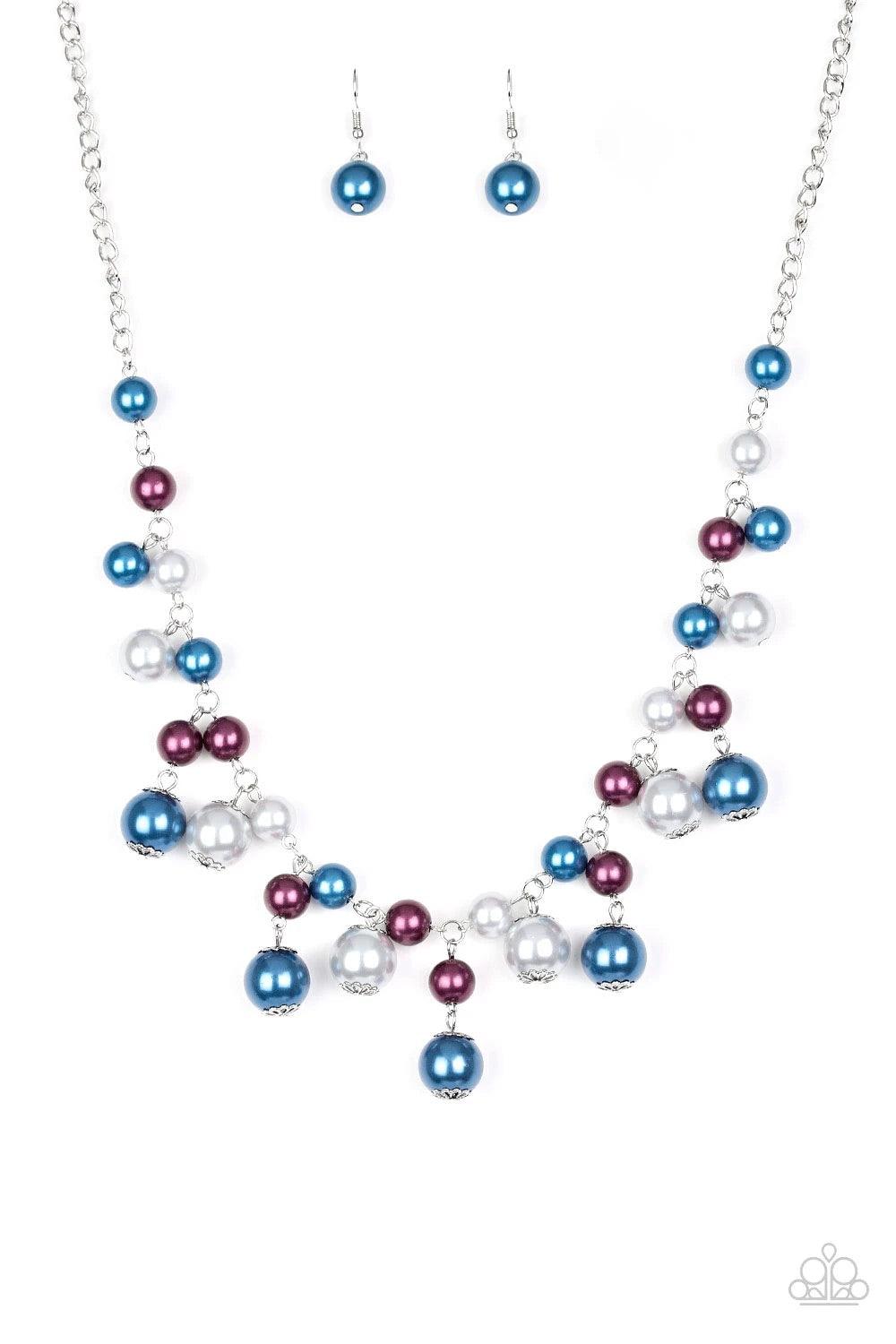Paparazzi Accessories Soon To Be Mrs. - Multi Varying in size, bubbly blue, purple, and silver pearls swing from the bottom of a classic strand of pearls, creating a refined fringe below the collar. Features an adjustable clasp closure. Sold as one indivi