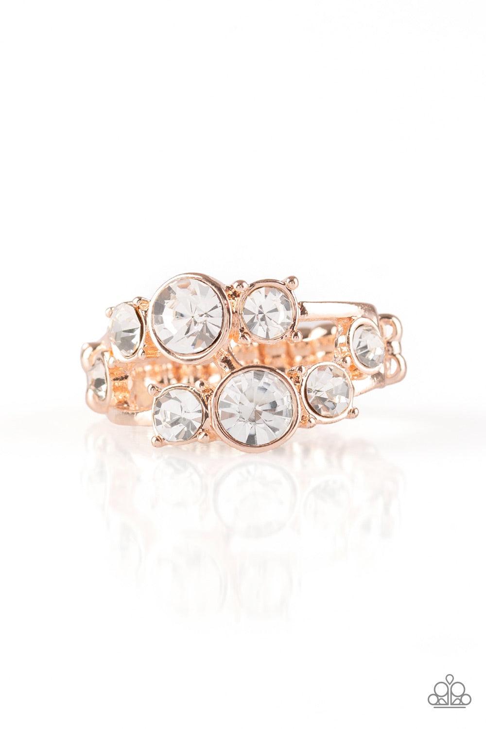 Paparazzi Accessories Interstellar Fashion - Rose Gold Rows of glittery white rhinestones connect across the finger, coalescing into a glamorous band. Features a dainty stretchy band for a flexible fit.