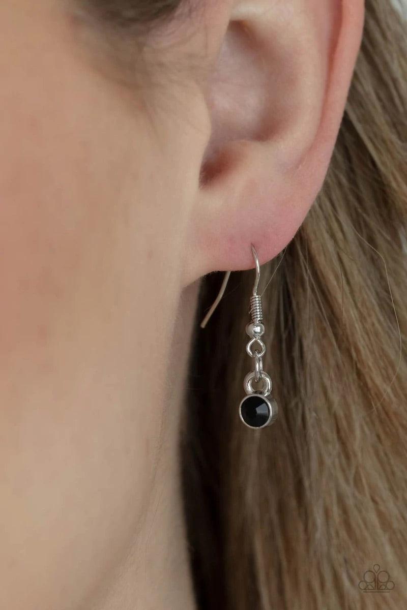Paparazzi Accessories Tower of Transcendence - Black A sparkly collection of white, smoky, and black rhinestones are encrusted along a silver pendulum that swings along the bottom of a silver chain, creating a glittery ombre effect. Features an adjustable