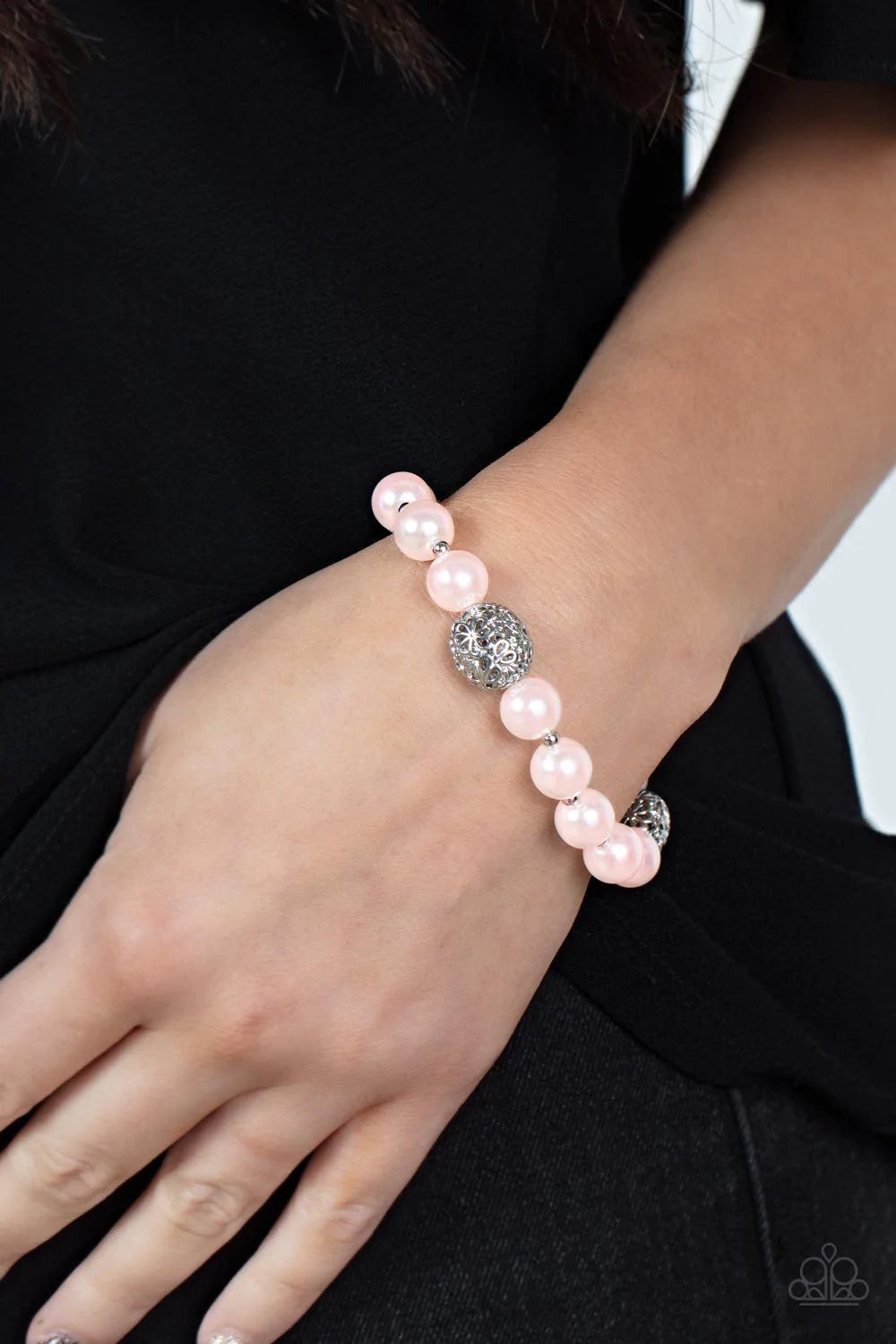 Paparazzi Accessories Upscale Whimsy - Pink Airy silver beads, featuring a floral filigree design, add a touch of whimsy to a strand of luminous pink pearl-like beads threaded along a stretchy band for a playfully upscale charm around the wrist. Sold as o