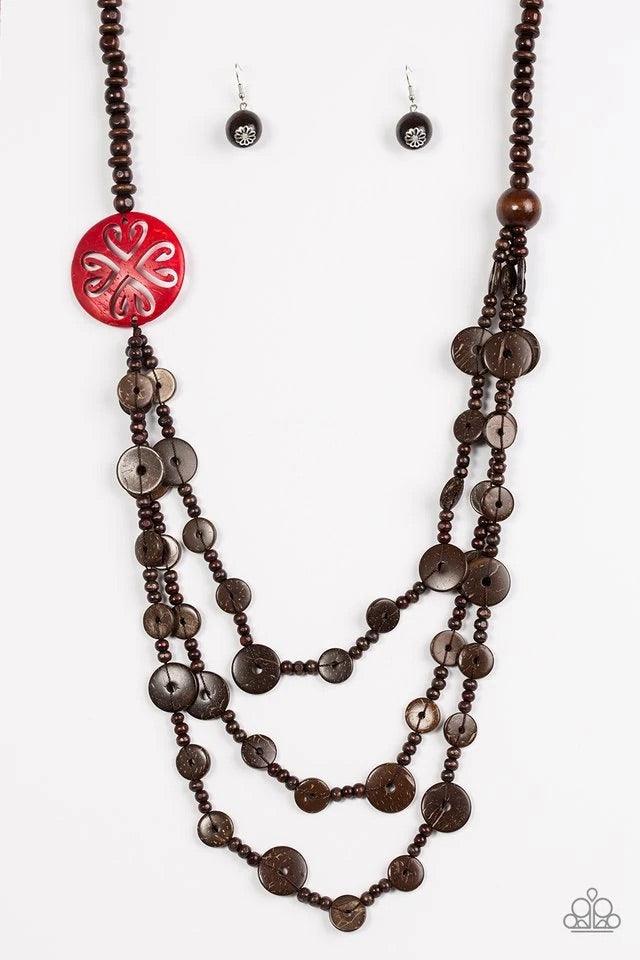 Paparazzi Accessories Jungle Jive - Red Mismatched brown wooden beads are threaded along a shiny brown string, creating summery layers across the chest. Featuring a whimsical floral pattern, a dramatic red wooden bead adorns one side for a seasonal finish
