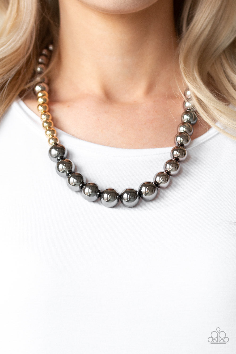 Paparazzi Accessories Power To The People - Black Varying in size, glistening gold and shimmery gunmetal beads drape below the collar in a dramatically asymmetrical fashion. Features an adjustable clasp closure. Sold as one individual necklace. Includes o