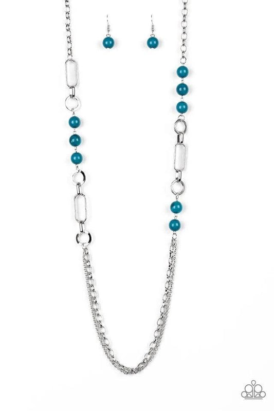 Paparazzi Accessories Cache Me Out - Blue A collection of glassy and polished blue beads give way to layers of mismatched silver chain for a whimsical look. Features an adjustable clasp closure. Sold as one individual necklace. Includes one pair of matchi