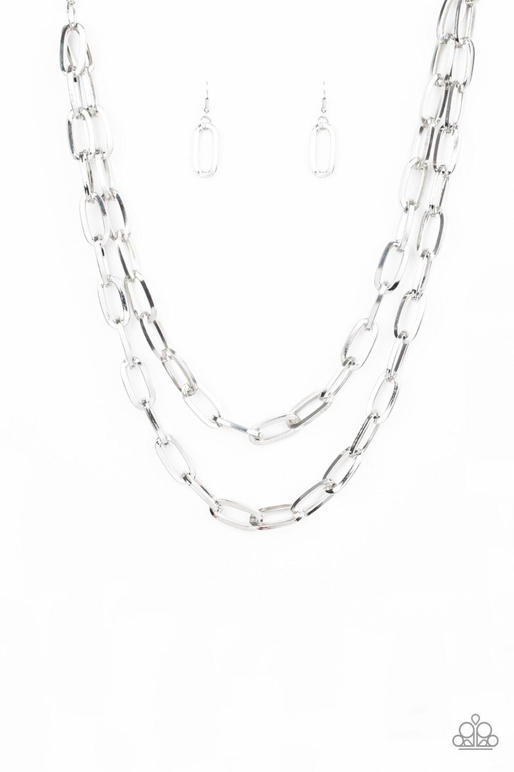 Paparazzi Accessories Make A CHAINge - Silver Dramatically oversized silver links connect below the collar, creating two bold layers below the collar for a knockout look. Features an adjustable clasp closure. Jewelry