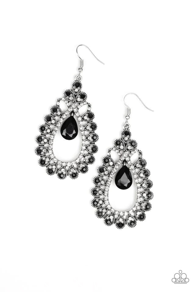 Paparazzi Accessories All About Business - Black A black teardrop gem swings from the top of a frilly silver frame radiating with glassy white and glittery black rhinestone encrusted petals for a regal look. Earring attaches to a standard fishhook fitting