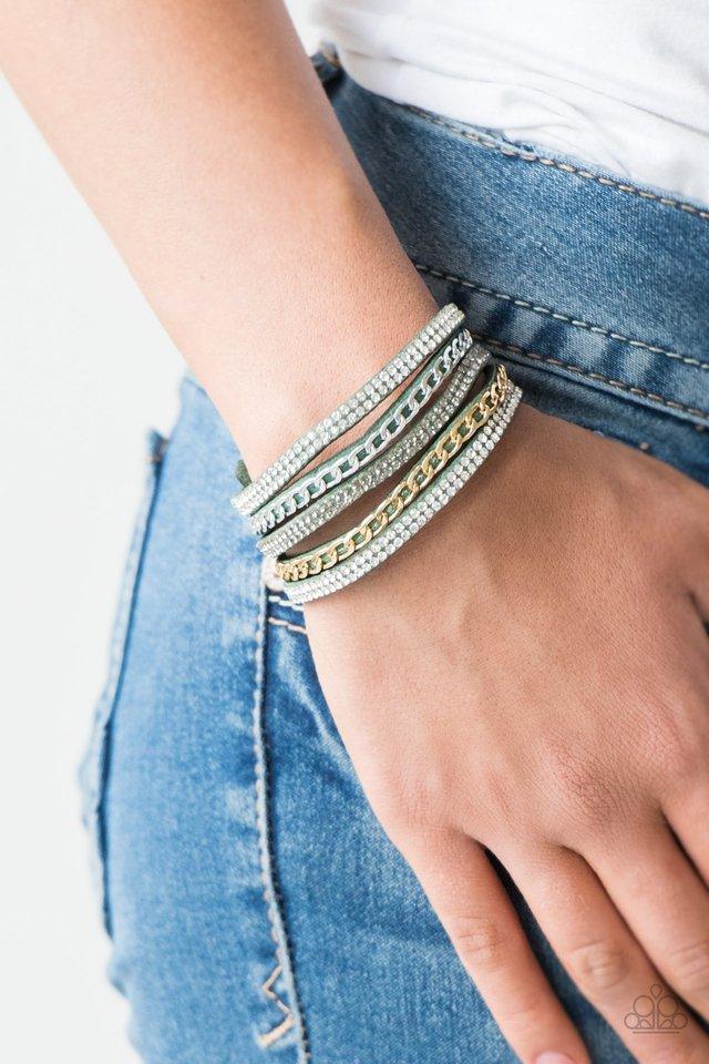 Paparazzi Accessories Fashion Fiend - Green Glassy white and smoky rhinestones are encrusted along strands of green suede. Glistening silver and gold chains are added to the bands, adding edgy industrial shimmer to the sassy palette. Features an adjustabl
