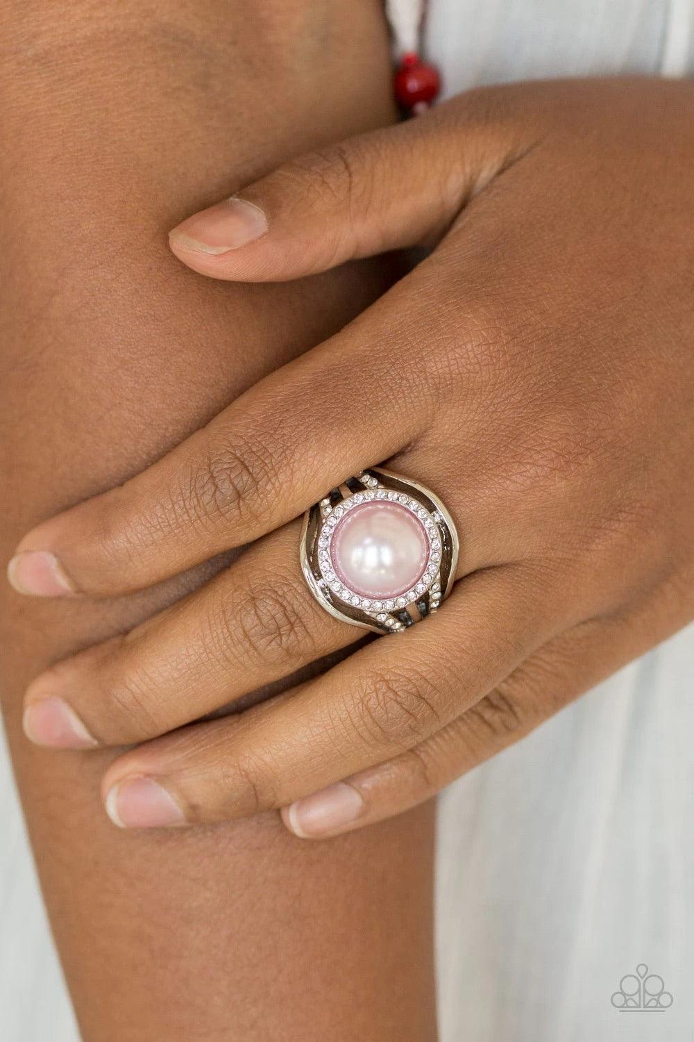 Paparazzi Accessories Pampered in Pearls - Pink Shiny silver bands and white rhinestone encrusted bands flare from a pink pearl drop center for a glamorous look. Features a stretchy band for a flexible fit. Sold as one individual ring. Rings