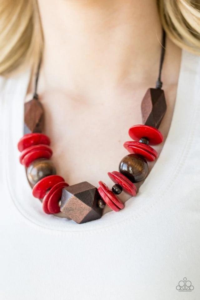 Paparazzi Accessories Pacific Paradise - Red Featuring abstract geometric finishes, mismatched brown wooden beads and fiery red accents are threaded along shiny brown cording. A dramatic geometric bead adorns the center, creating a bold summery look below