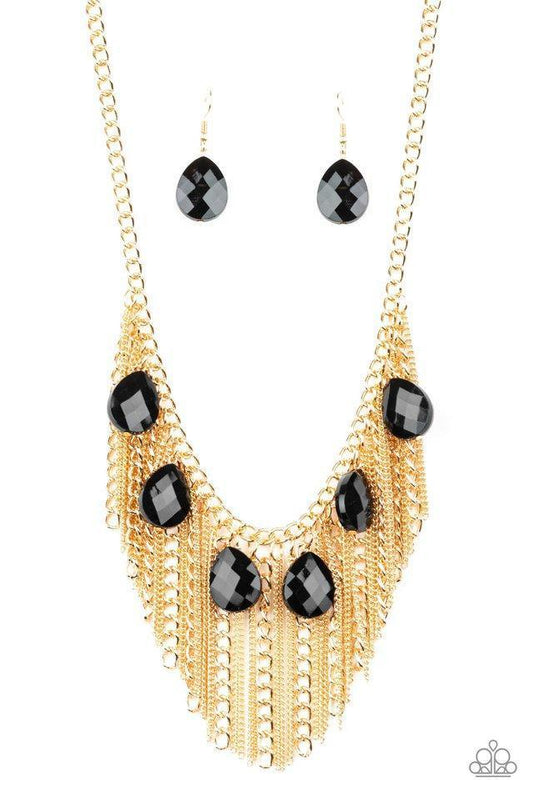 Paparazzi Accessories Vixen Conviction - Gold Infused with a row of faceted black teardrops, mismatched strands of gold chains stream from the bottom of a glistening gold chain, creating a statement-making fringe below the collar. Features an adjustable c