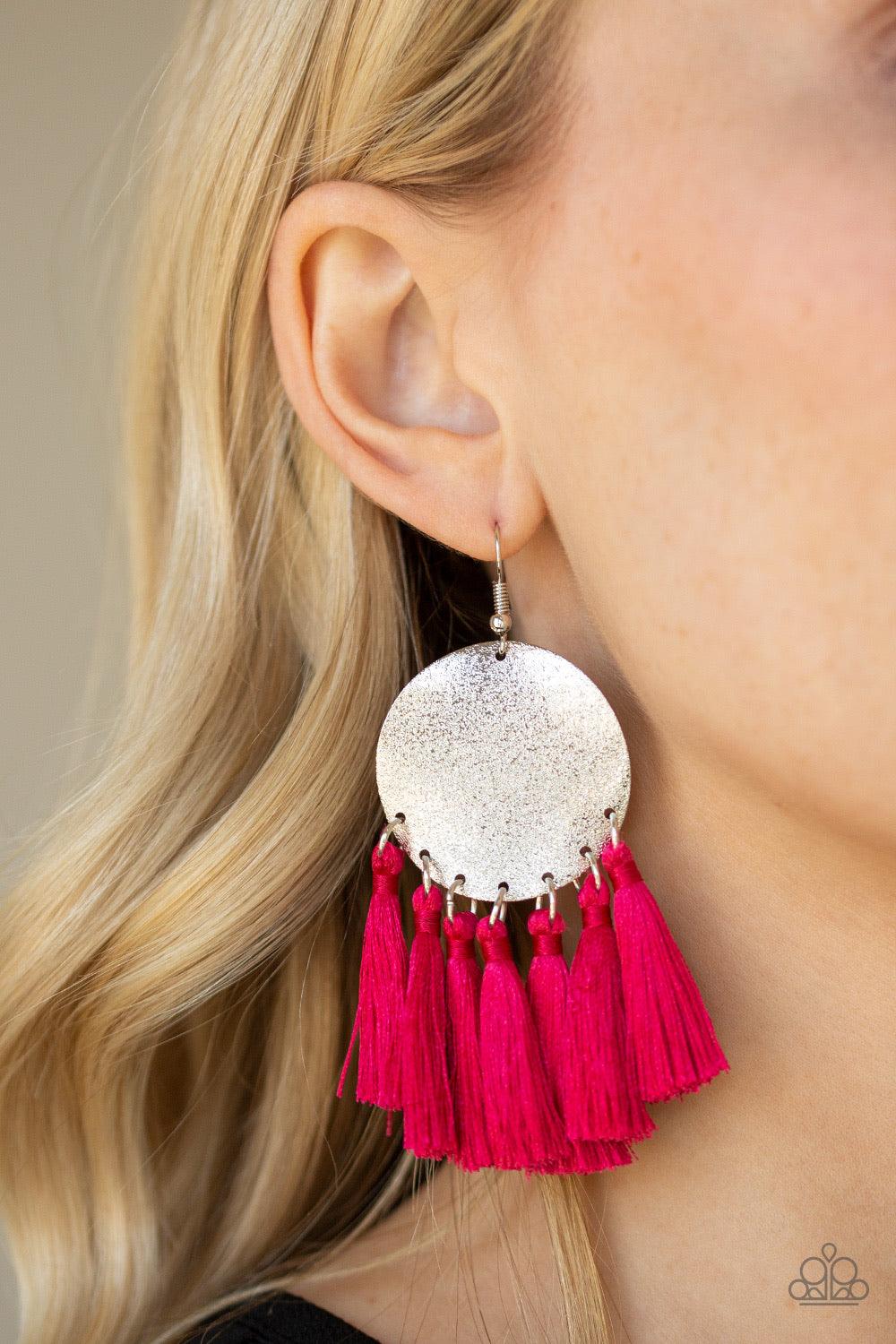 Paparazzi Accessories Tassel Tribute - Pink A fringe of shiny pink threaded tassels swing from the bottom of a warped silver disc brushed in an incandescent metallic shimmer for a whimsical flair. Earring attaches to a standard fishhook fitting. Jewelry