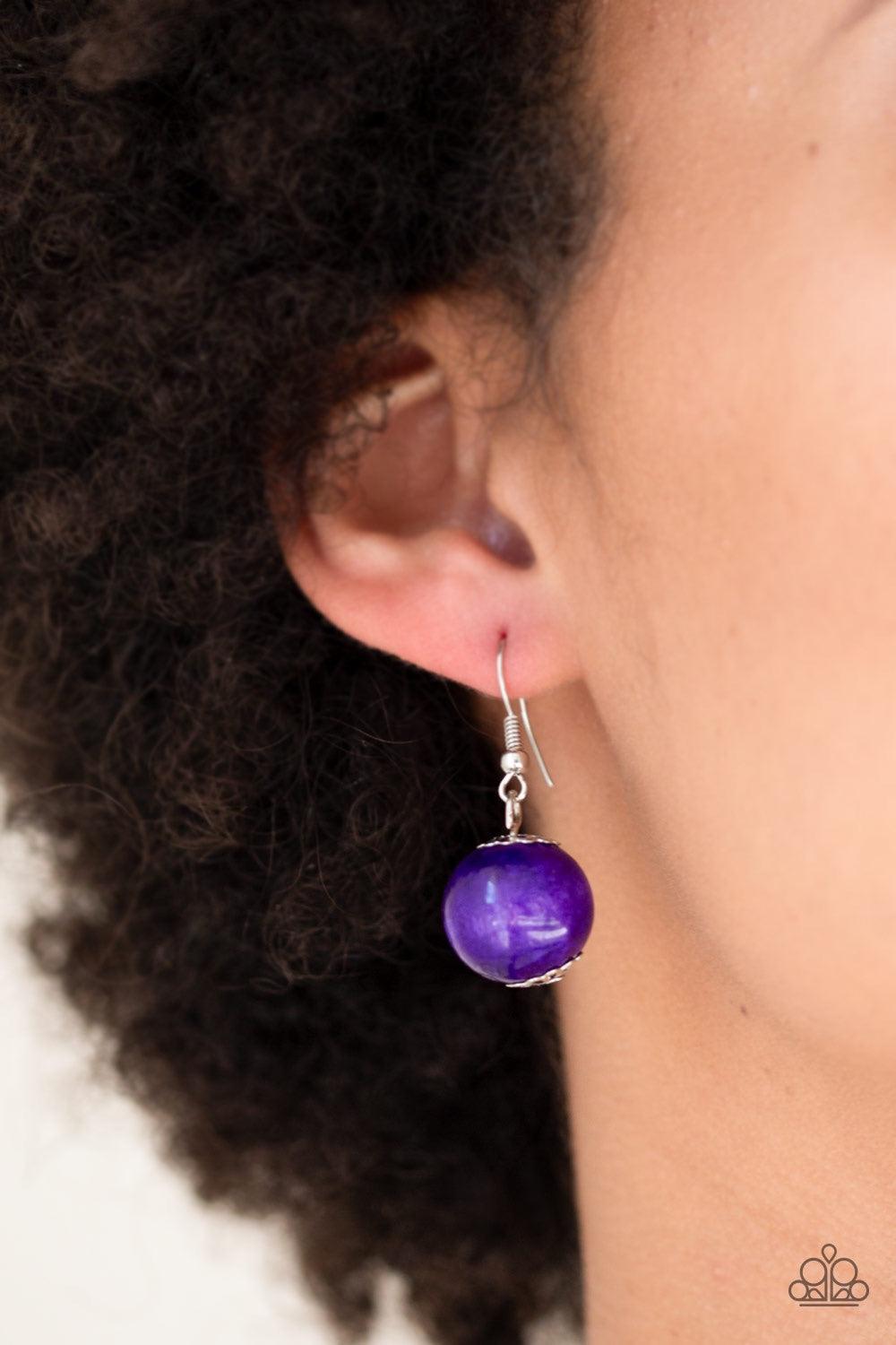 Paparazzi Accessories Panama Panorama - Purple Infused with dramatic silver beads, an array of vivacious purple wooden beads drape across the chest for a summery look. Features a button-loop closure. Jewelry