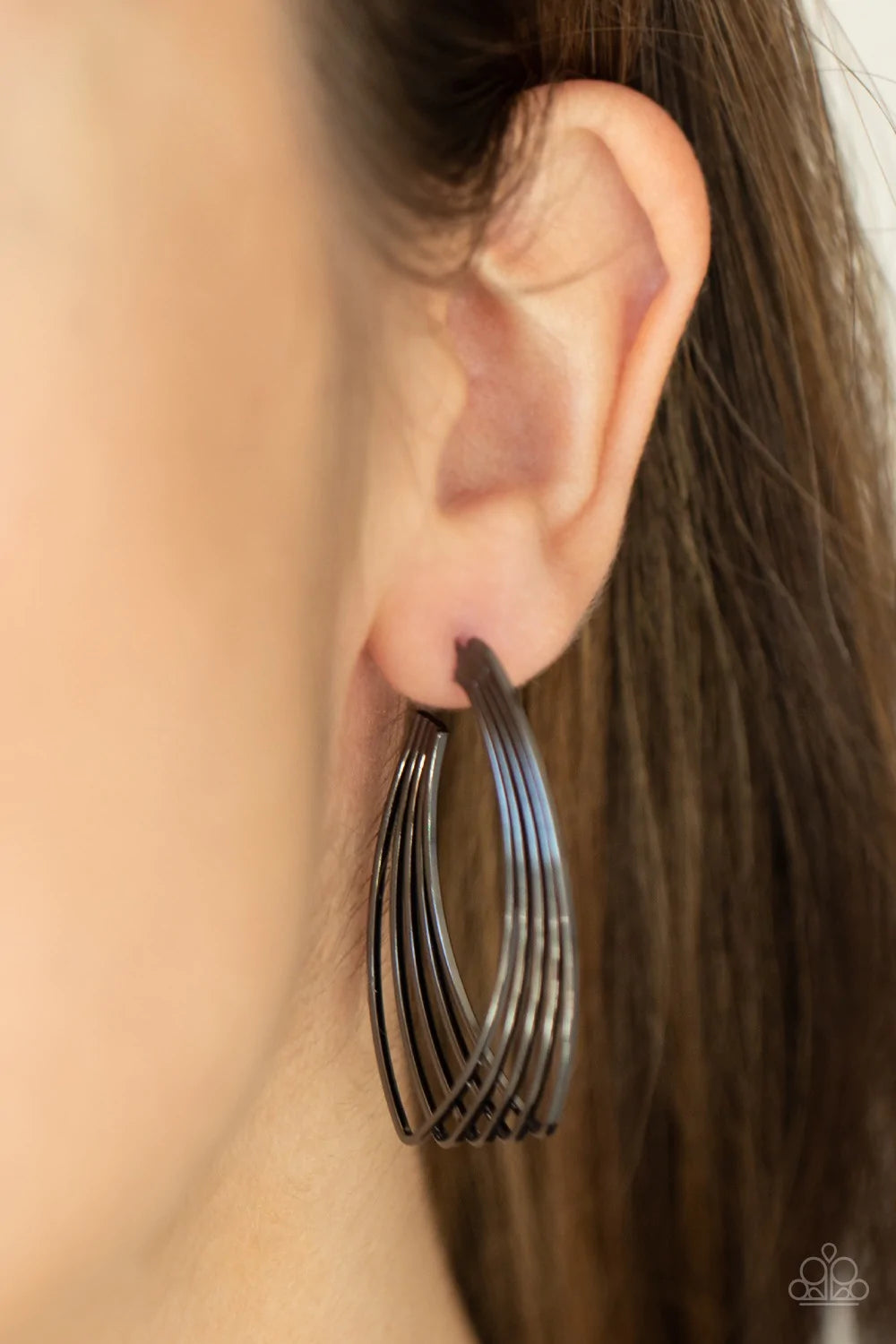 Paparazzi Accessories Industrial Illusion - Black A shiny collection of dainty gunmetal wires twist and layer into a hook shaped frame, creating an edgy illusion. Earring attaches to a standard post fitting. Hoop measures approximately 1" in diameter. Sol