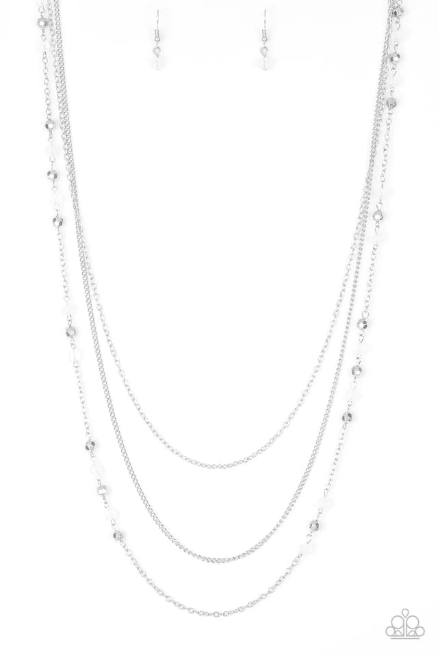 Paparazzi Accessories Colorful Cadence - White Faceted silver and glassy white beads trickle along shimmery silver chains down the chest for a whimsical look. Features an adjustable clasp closure. Jewelry