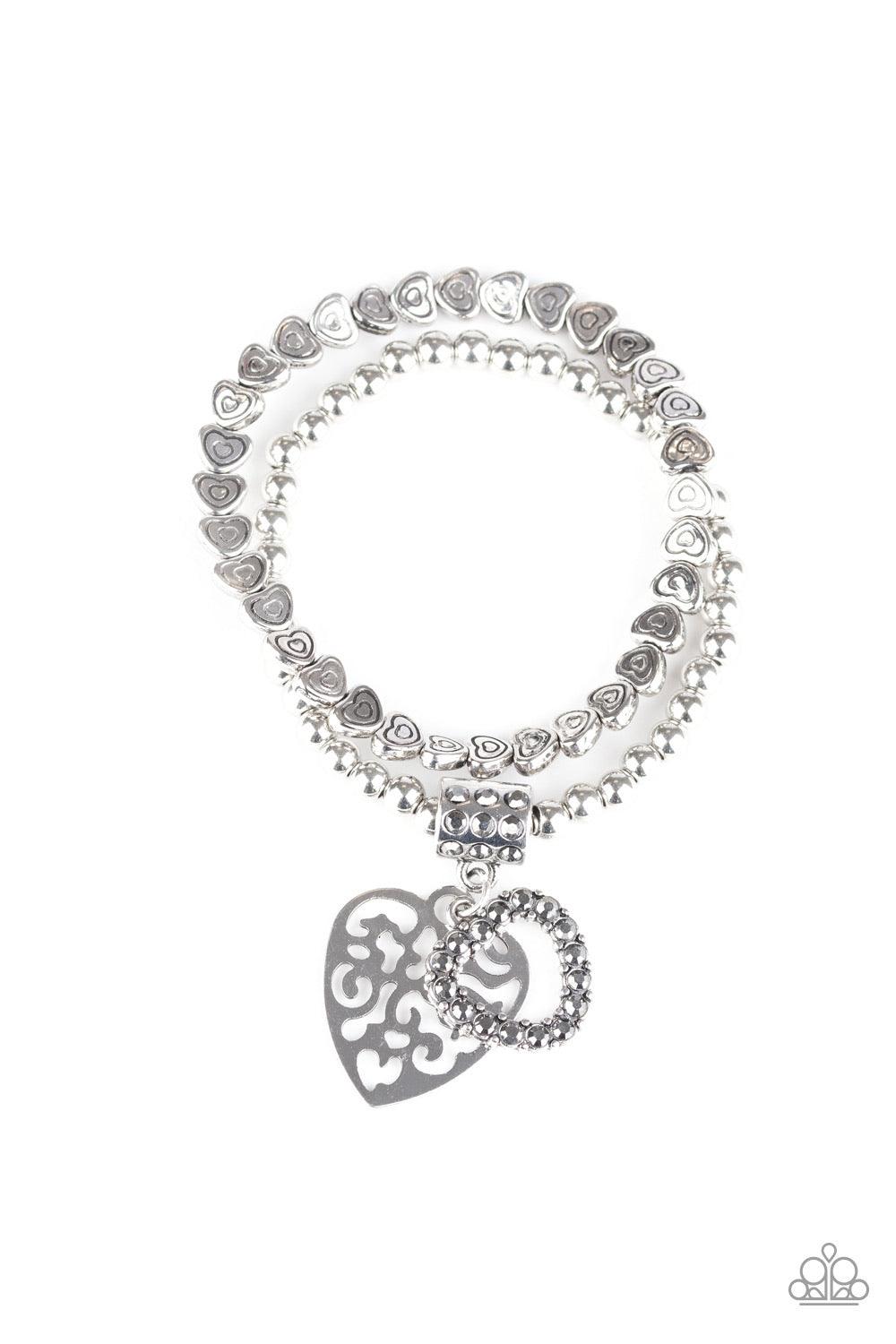 Paparazzi Accessories Think With Your Heart - Silver Brushed in an antiqued finish, classic silver beads and dainty silver heart beads are threaded along stretchy bands around the wrist, creating an adorable duo. Infused with a hematite rhinestone encrust