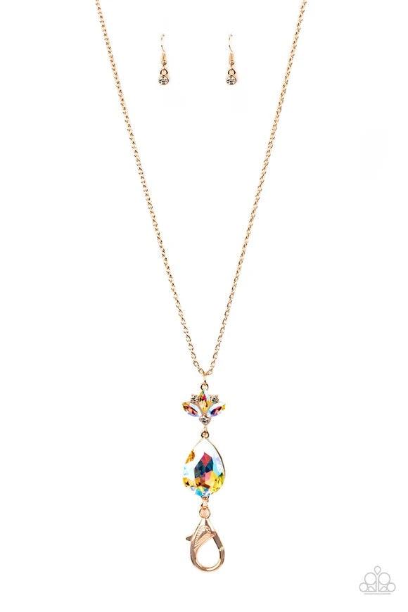 Paparazzi Accessories Divine Dazzle - Rose Gold Infused with a trio of glassy white rhinestones, a dainty frame of three marquise cut iridescent rhinestones give way to an oversized iridescent teardrop gem at the bottom of a lengthened rose gold chain for