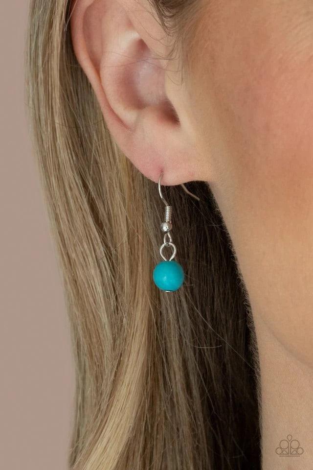 Paparazzi Accessories ZEN You Least Expect It ~Blue A rustic collection of silver discs, ornate silver beads, and refreshing turquoise stones are threaded along an invisible wire below the collar for a seasonal look. Features an adjustable clasp closure.