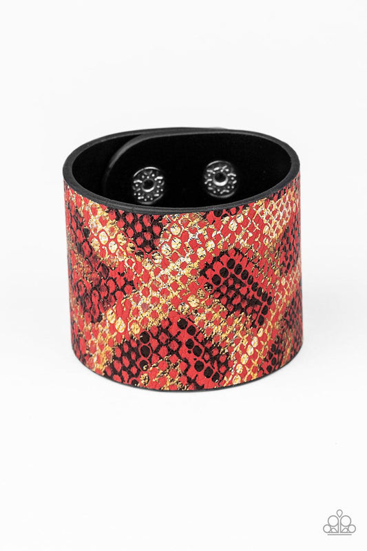 Paparazzi Accessories Serpent Shimmer - Red Featuring a shiny gold and black python print, a thick red leather band wraps around the wrist for a wild shimmer. Features an adjustable snap clos Jewelry