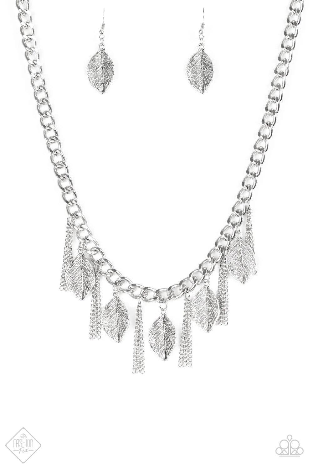 Paparazzi Accessories Serenely Sequoia - Silver Decorated in lifelike textures, glistening silver leaves swing from the bottom of a bold silver chain. Infused with sections of silver chain tassels, the leafy fringe drapes below the collar for a seasonal l