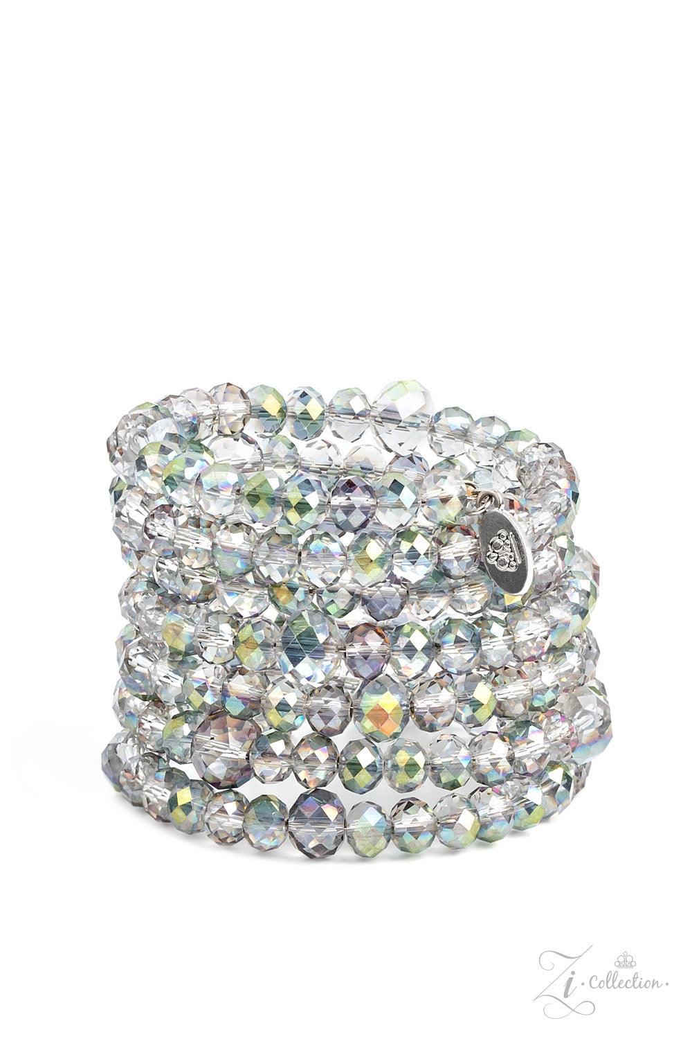 Paparazzi Accessories Inner Radiance Countless clear, crystal-like beads are threaded along a coiled wire, creating an infinity wrap bracelet. Each faceted edge of the beads is brushed in a dreamily iridescent or hypnotic oil spill finish that flickers an