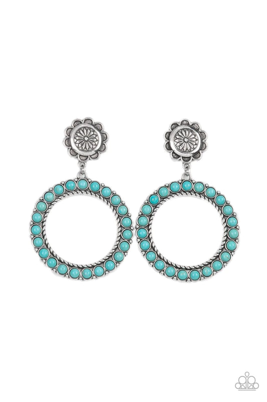 Paparazzi Accessories Playfully Prairie - Blue Featuring studded and twisted rope-like silver accents, a turquoise stone dotted hoop swings from the bottom of a rustic silver flower for a whimsically floral fashion. Earring attaches to a standard post fit
