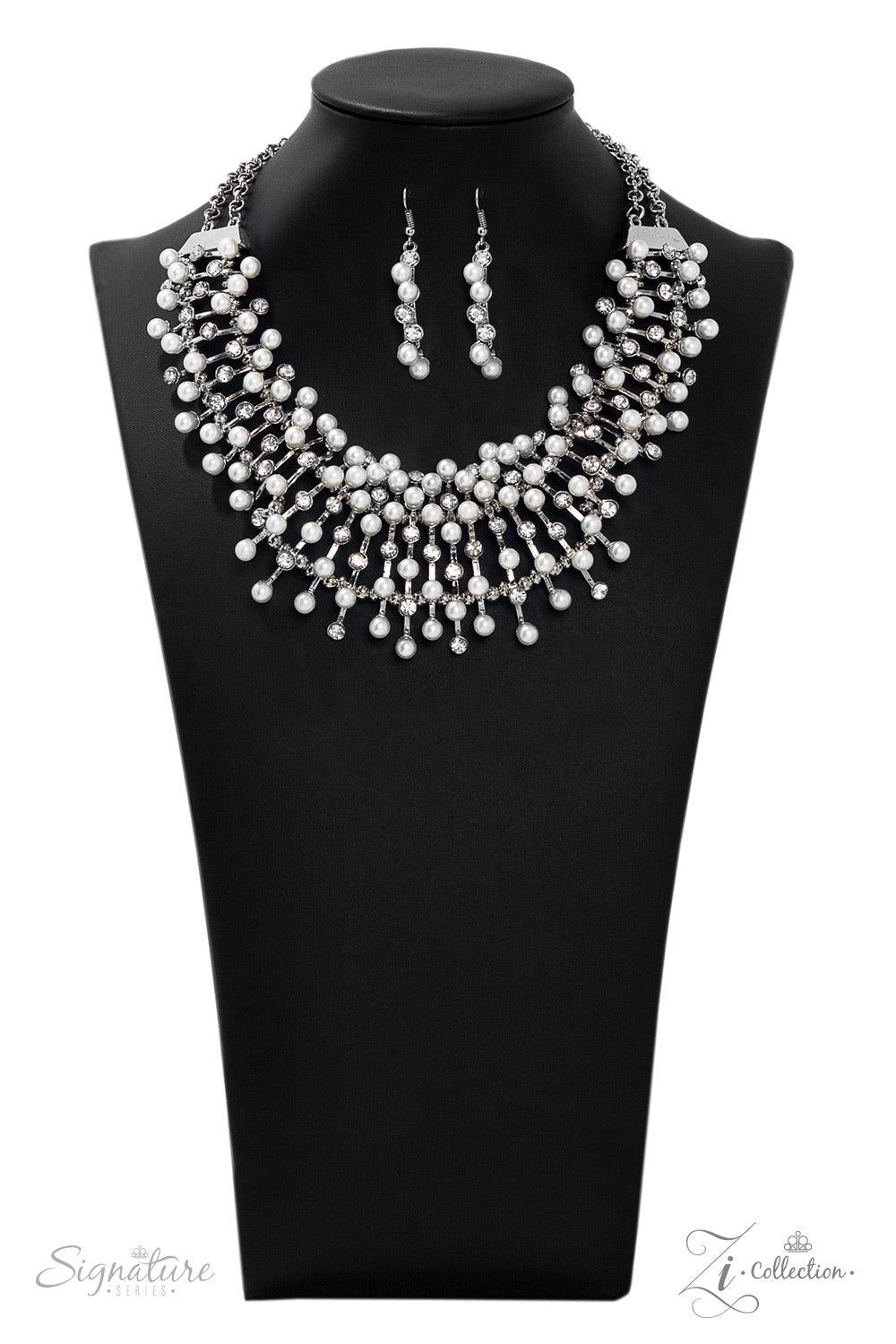 Paparazzi Accessories The Leanne 💗ZiCollection $25💗 A collection of sleek silver bars fans out along the collar in a regal display. Each bar is dotted in dainty white pearls and sparkling white rhinestones, resulting in a perfect mix of polished refinem