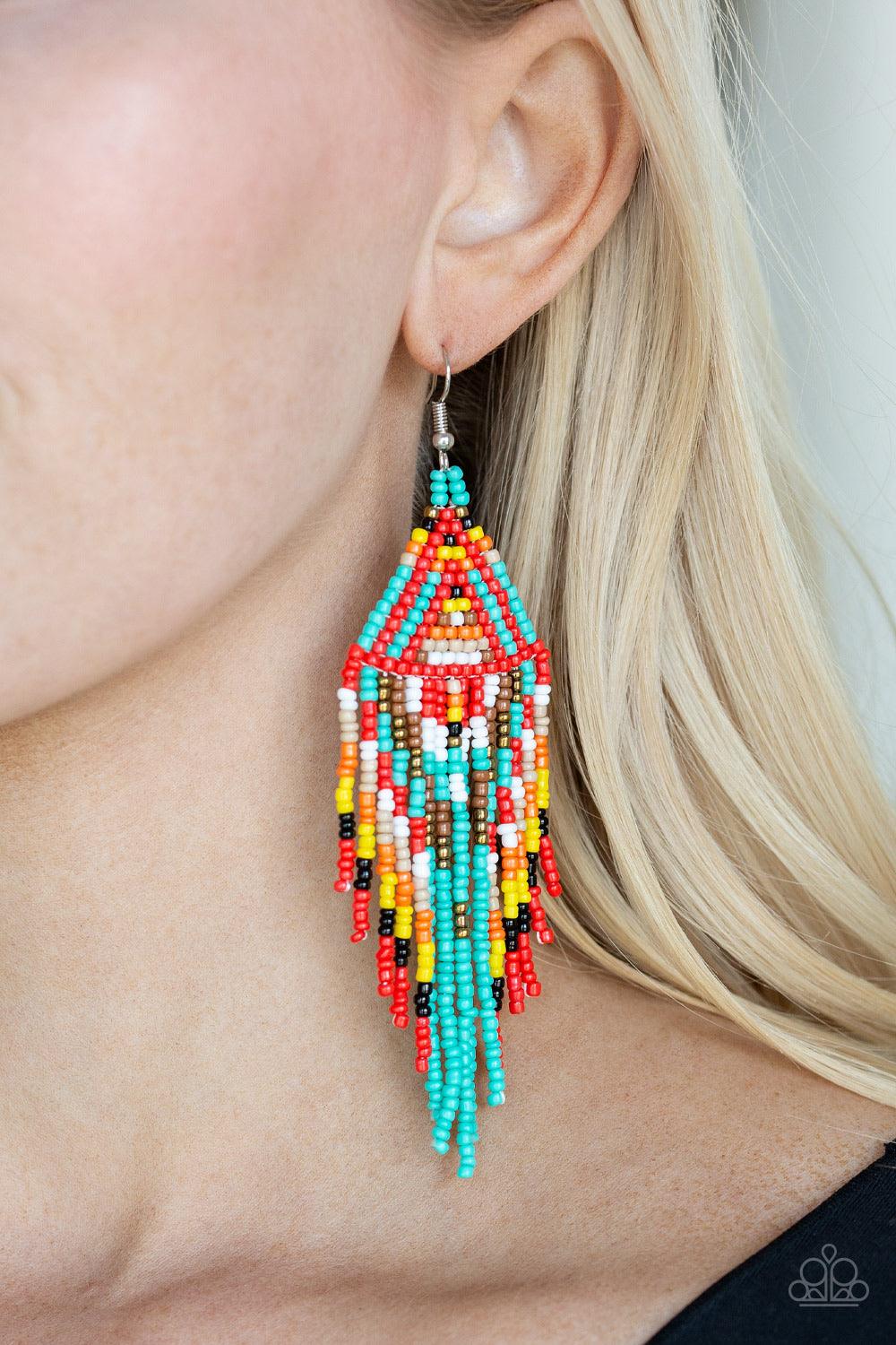 Paparazzi Accessories Boho Blast - Blue Featuring black, blue, brass, brown, orange, white, red, and yellow seed beads, dainty beaded tassels swing from a beaded triangular frame for a colorful tribal look. Earring attaches to a standard fishhook fitting.