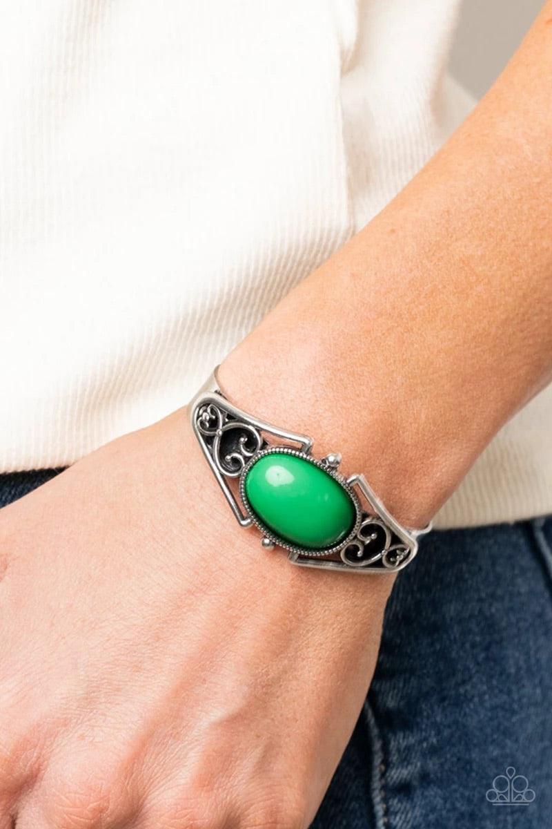 Paparazzi Accessories Springtime Trendsetter - Green A bubbly Mint bead is nestled inside a silver filigree filled frame atop a dainty silver cuff, creating a whimsical centerpiece around the wrist. Sold as one individual bracelet. Jewelry