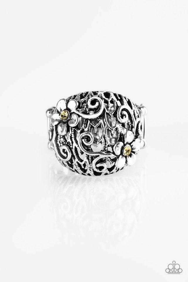 Paparazzi Accessories Spring Holiday - Yellow Dotted with dainty yellow rhinestone centers, whimsical silver flowers bloom across the front of a thick silver band for a seasonal look. Features a stretchy band for a flexible fit. Jewelry