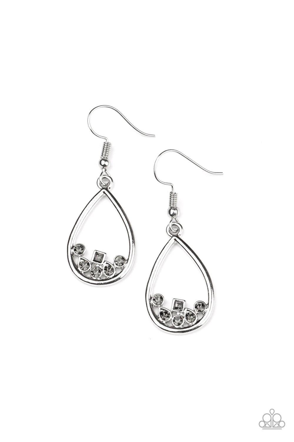 Paparazzi Accessories Raindrop Radiance - Silver Varying in shape, a collection of dainty smoky rhinestones collect at the bottom of an airy silver teardrop frame for a timeless finish. Earring attaches to a standard fishhook fitting. Sold as one pair of