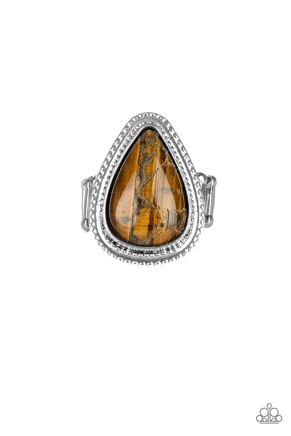 Paparazzi Accessories Mojave Mist - Brown Chiseled into a tranquil teardrop, a rugged Tiger's Eye stone is pressed into a textured silver teardrop frame for a seasonal look. As the stone elements in this piece are natural, some color variation is normal.