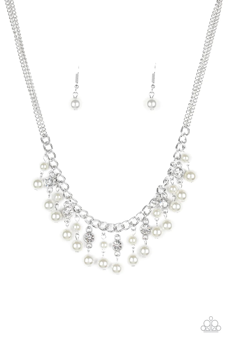 Paparazzi Accessories Regal Refinement - White Alternating with glassy white rhinestones, pearly white beaded tassels swing from the bottom of a shimmery silver chain below the collar for a refined flair. Features an adjustable clasp closure. Sold as one