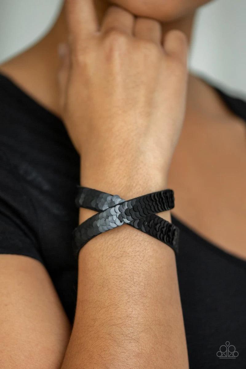 Paparazzi Accessories Under the Sequins - Black Row after row of shimmery sequins are stitched across the front of a lengthened black suede band. The elongated band allows for a trendy double wrap design. Bracelet features reversible sequins that change f