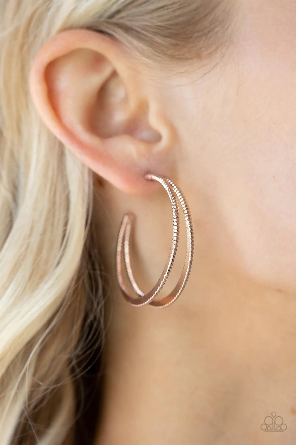 Paparazzi Accessories Rustic Curves - Rose Gold Featuring textured edges, two rose gold crescent frames delicately curve into a bold double hoop for an edgy urban look. Earring attaches to a standard post fitting. Hoop measures approximately 1 1/2" in dia