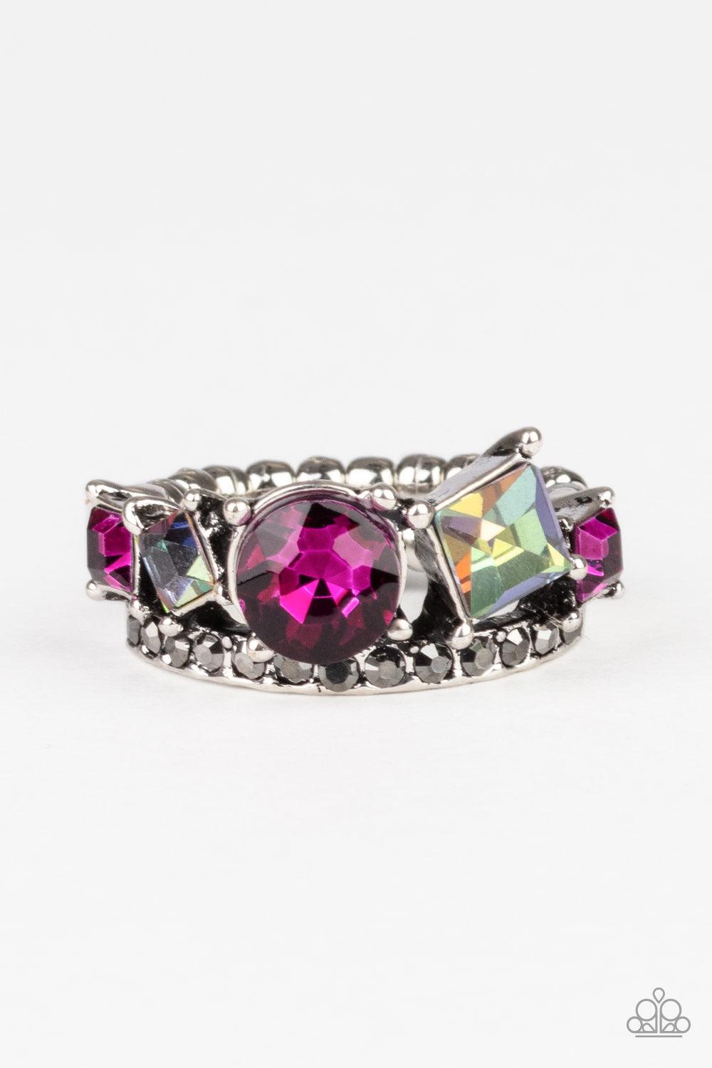 Paparazzi Accessories Champion Couture ~Pink A collection of round and square pink and oil spill rhinestones coalesce atop a silver band encrusted in dainty hematite rhinestones for a dramatic look. Features a dainty stretchy band for a flexible fit.