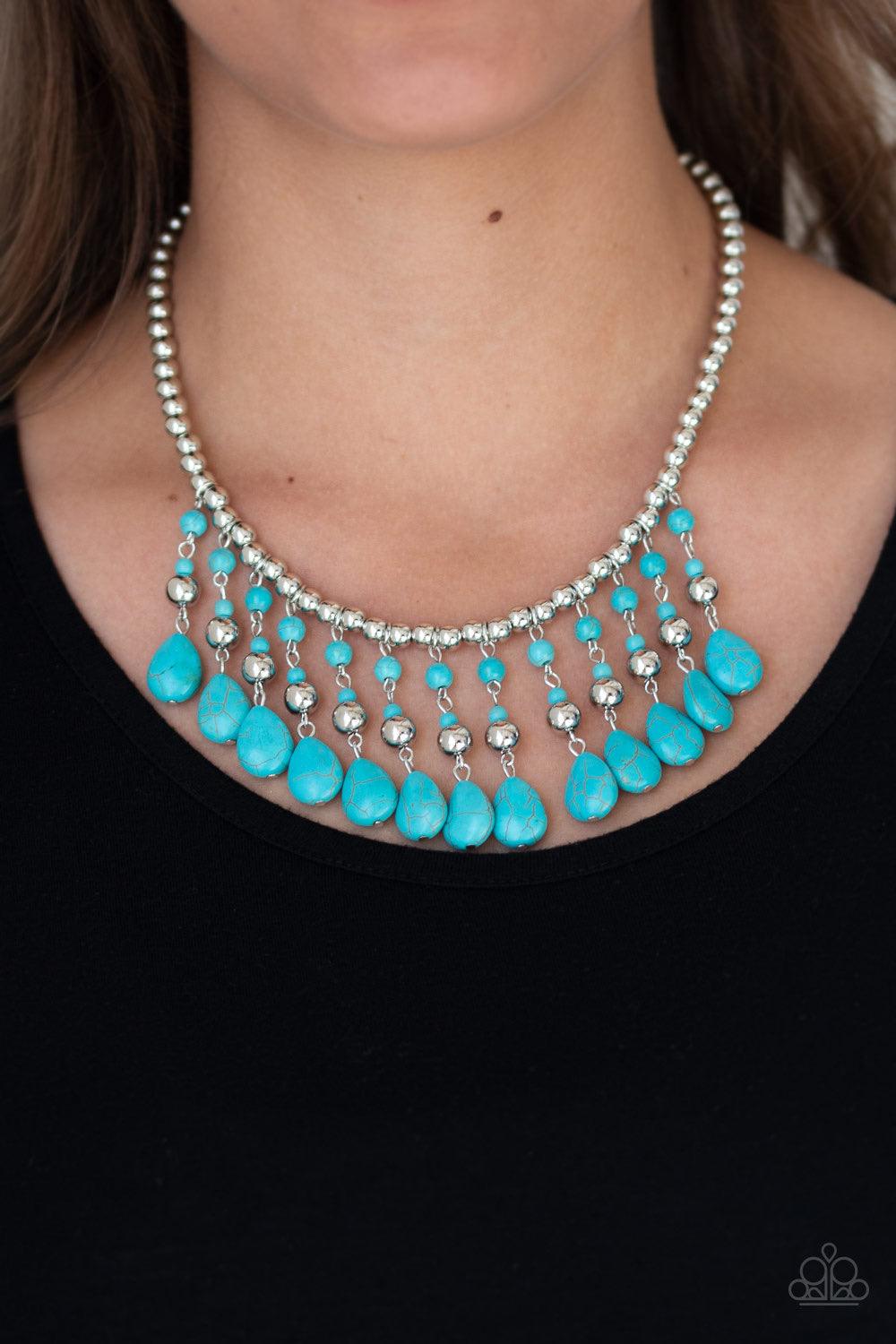 Paparazzi Accessories Rural Revival - Blue Shiny silver beads are threaded along an invisible wire below the collar. Infused with silver beaded accents, refreshing turquoise beads swing from the bottom of the beaded strand, creating an earthy fringe. Feat