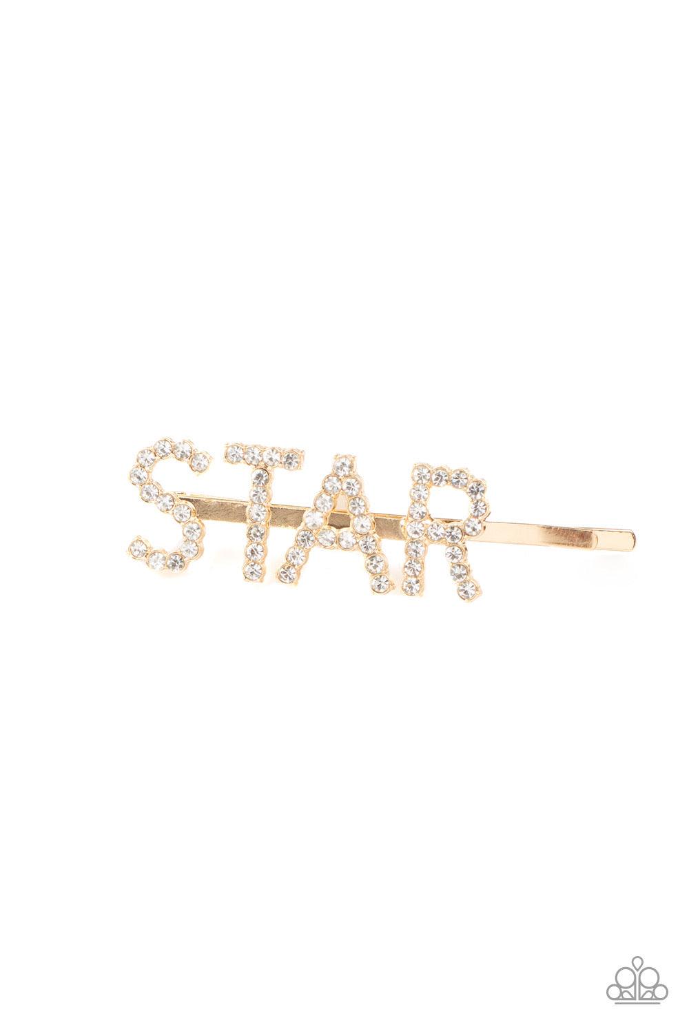Paparazzi Accessories Star In Your Own Show - Gold Encrusted in glittery white rhinestones, glistening gold letters spell out the word, "STAR," across the front of a gold bobby pin for a stellar look. Sold as one individual hair clip. Hair Accessories