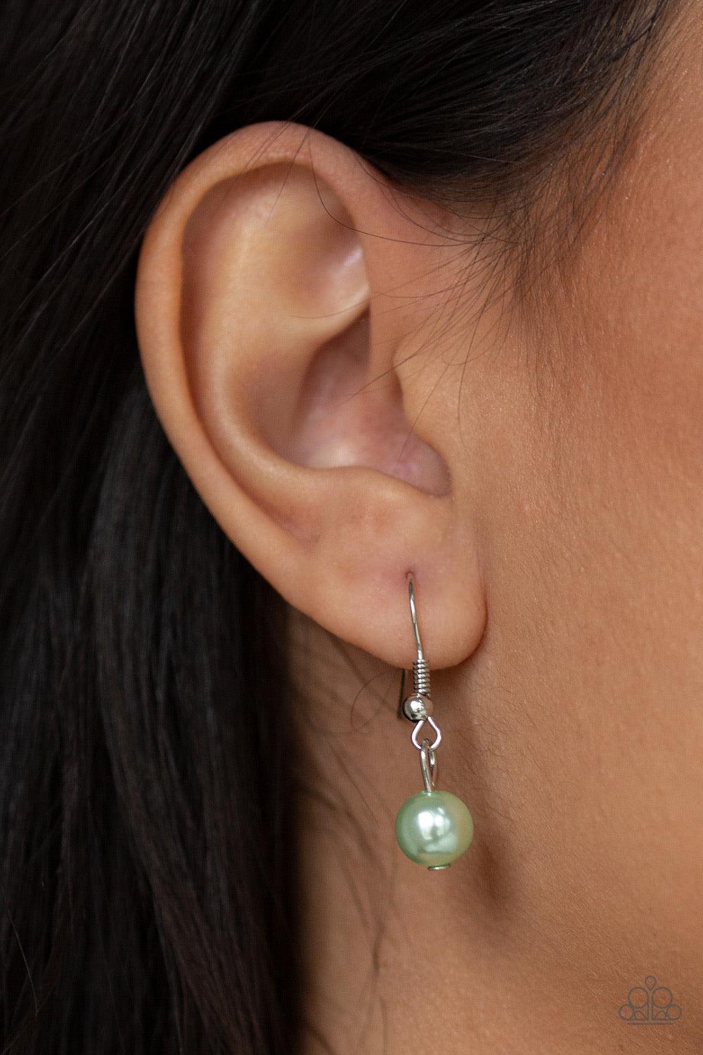 Paparazzi Accessories Kindhearted Heart - Green A collection of shiny silver beads and pearly green beads cascade from the bottoms of two layered silver chains. Stamped in the word, "Love", floral heart charms dangle from the lowermost chain, creating a f