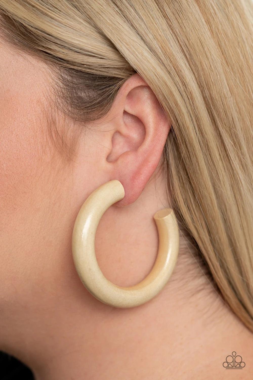 Paparazzi Accessories I WOOD Walk 500 Miles - White Painted in a neutral white finish, a thick wooden frame dramatically curls into an oversized hoop for a colorfully retro look. Earring attaches to a standard post fitting. Hoop measure approximately 2 1/