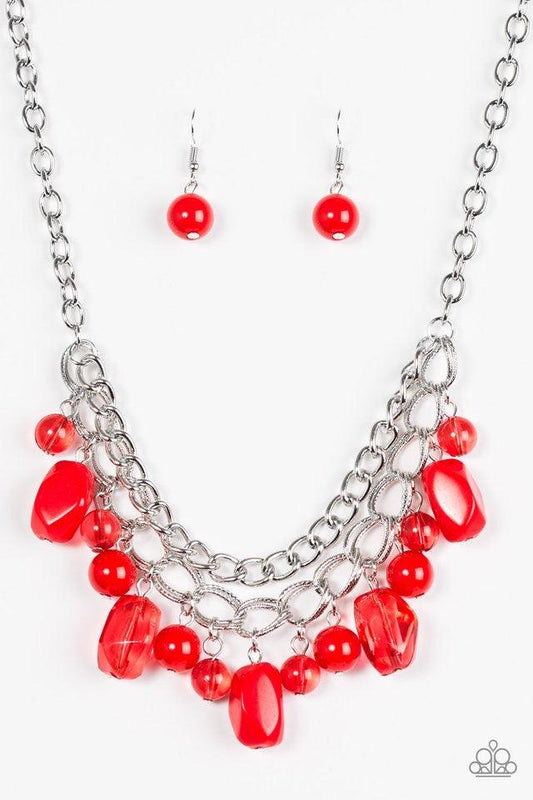 Paparazzi Accessories Brazilian Bay - Red Featuring glassy and polished finishes, round and asymmetrical red beads trickle from the bottom of a double-linked silver chain. An additional silver chain is layered above the summery beading for a seasonal fini