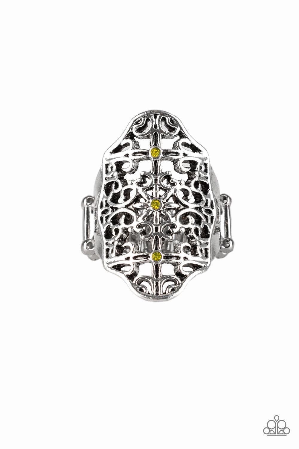 Paparazzi Accessories Botanical Beam - Yellow Glistening silver filigree swirls into a floral textile pattern across the finger. Glittery yellow rhinestones and dainty silver studs are sprinkled across the ornate silver frame for a whimsical finish. Featu