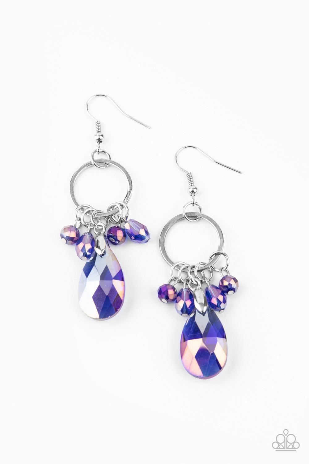 Paparazzi Accessories Unapologetic Glow ~Blue An oversized iridescent blue crystal-like teardrop swings from the bottom of a dainty silver hoop embellished with matching crystal-like beads, creating a glamorous fringe. Earring attaches to a standard fishh